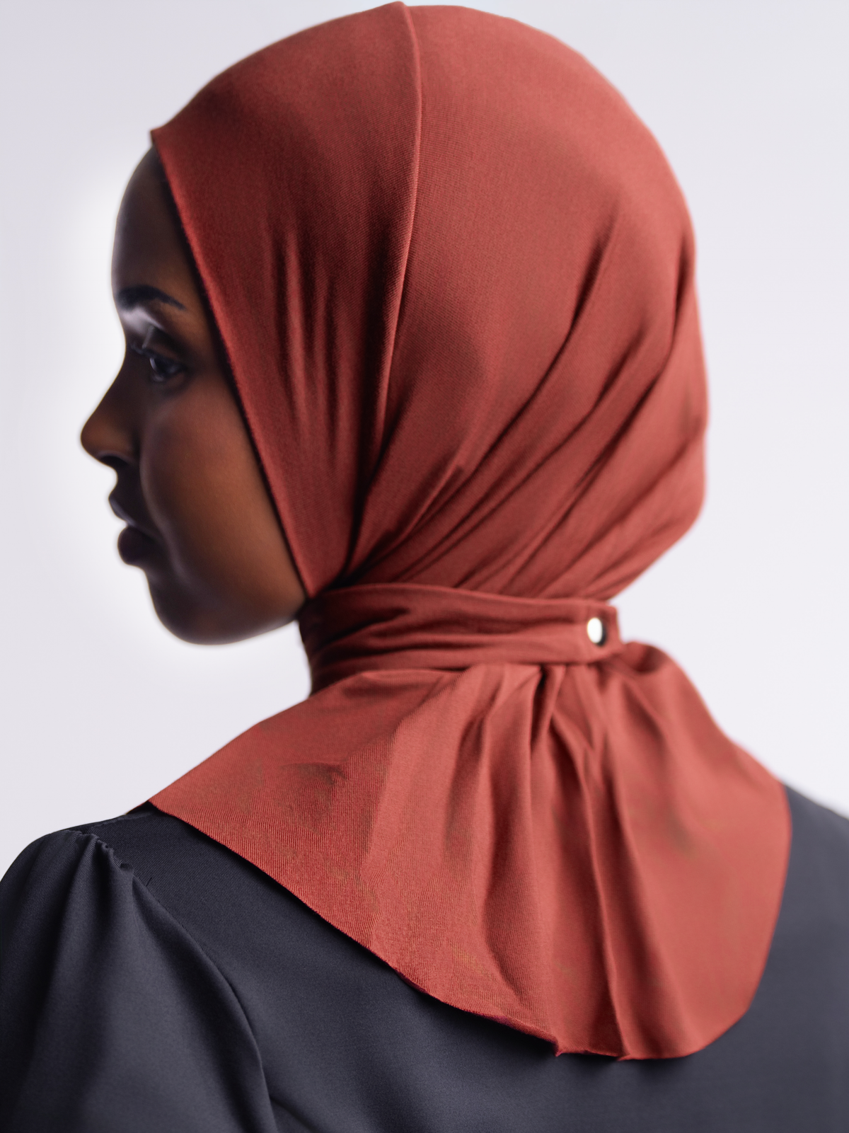 Chestnut | Solo Snap Hijab side view, showing the snap closure at the back of the neck and the drape over the shoulders