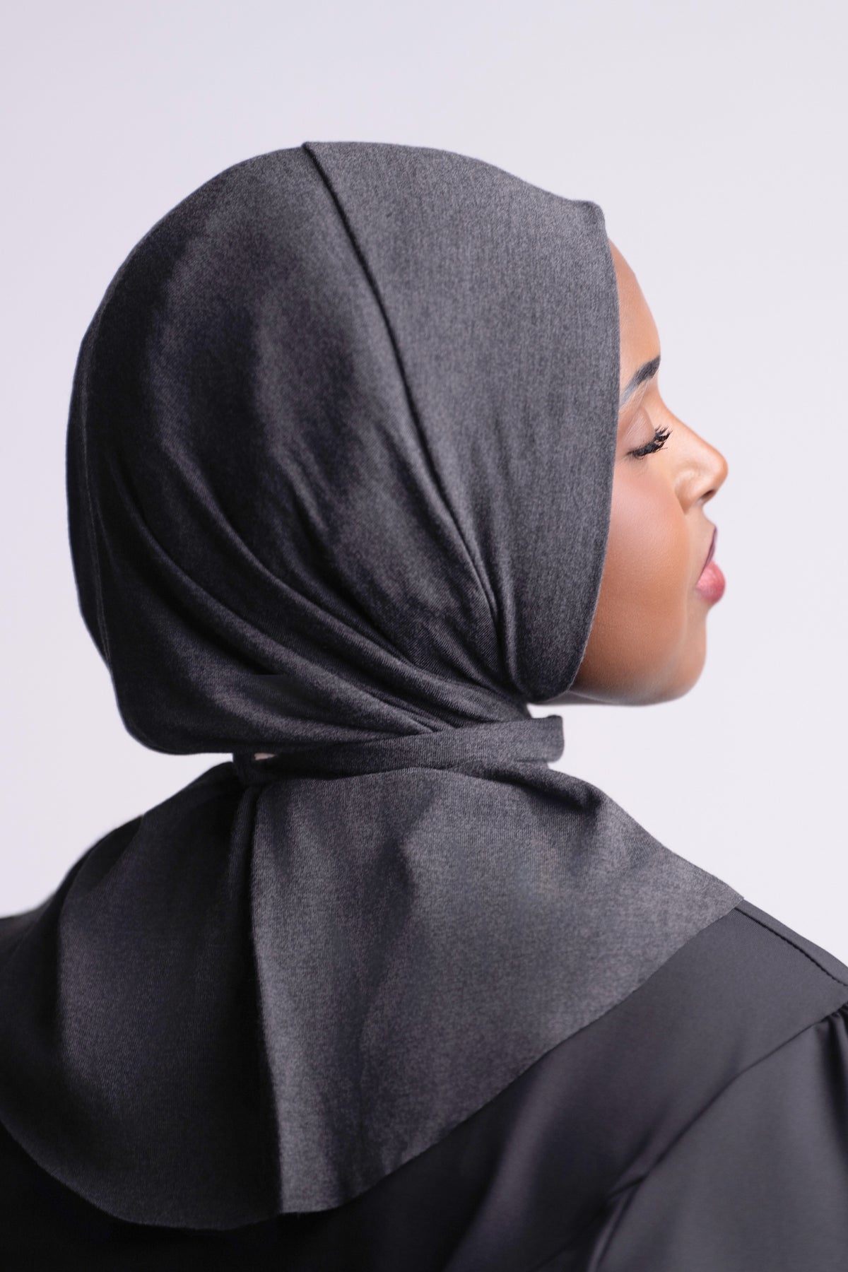 Solo Snap Hijab side view, showing the snap closure at the back of the neck and the drape over the shoulders