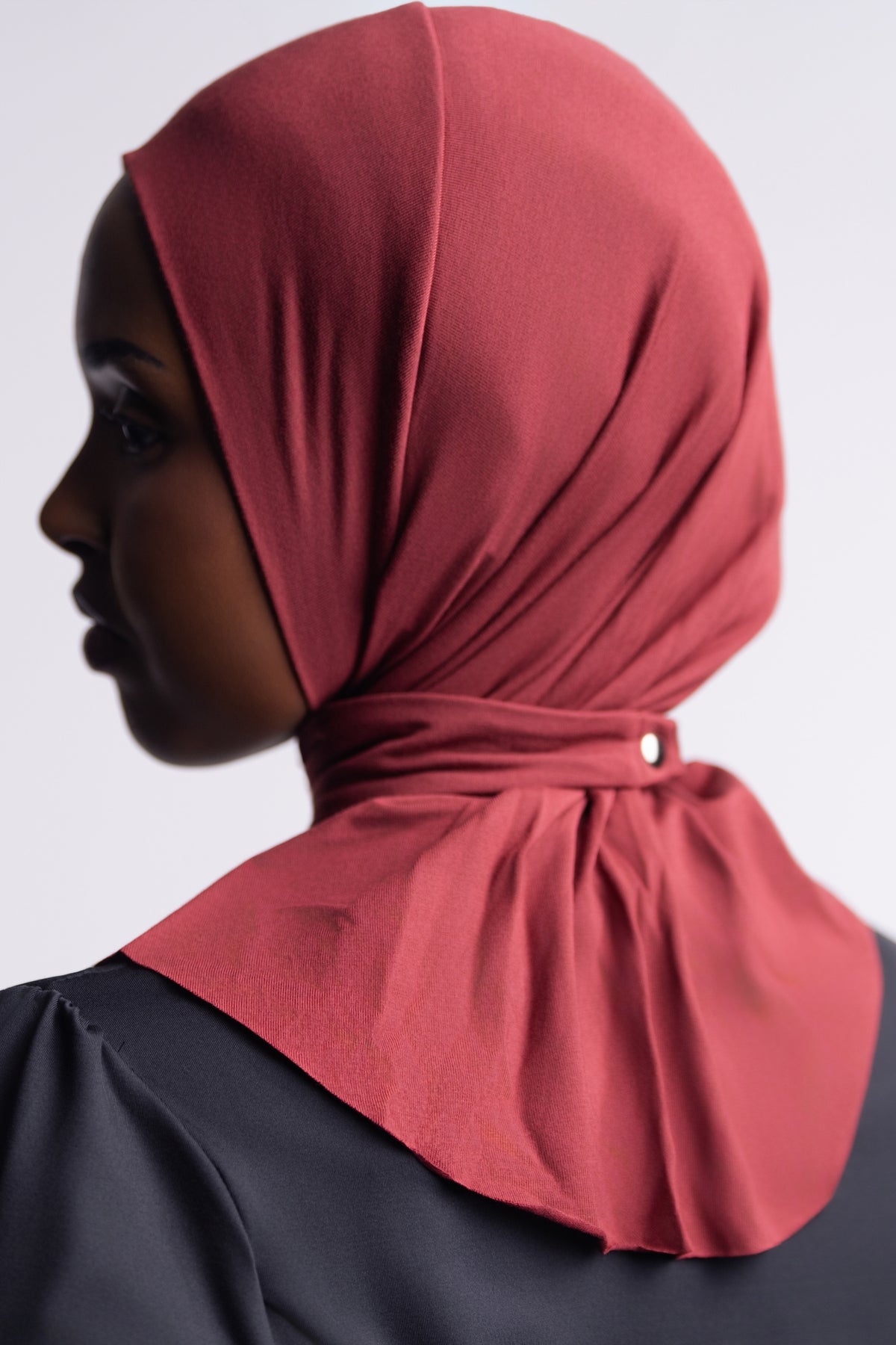 Henna | Solo Snap Hijab side view, showing the snap closure at the back of the neck and the drape over the shoulders