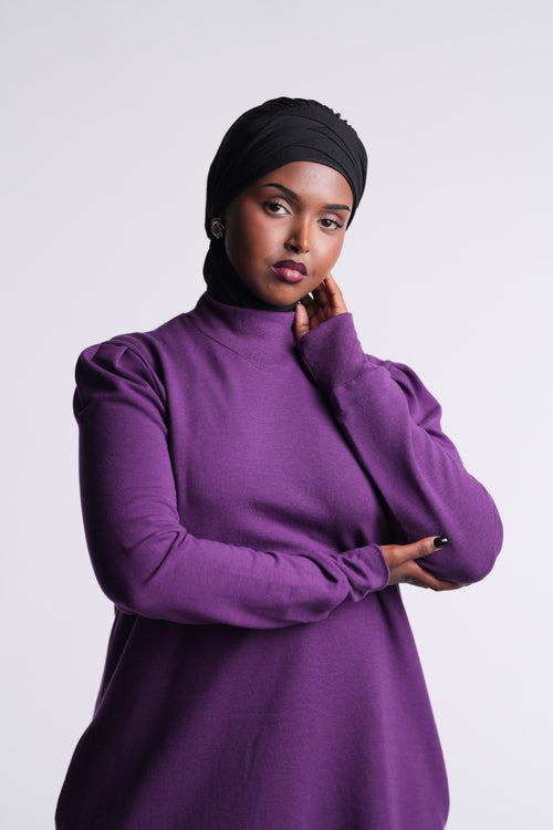 Berry Purple | Revive Fleece Pullover front view, mock neck and puff shoulders, worn with a black hijab