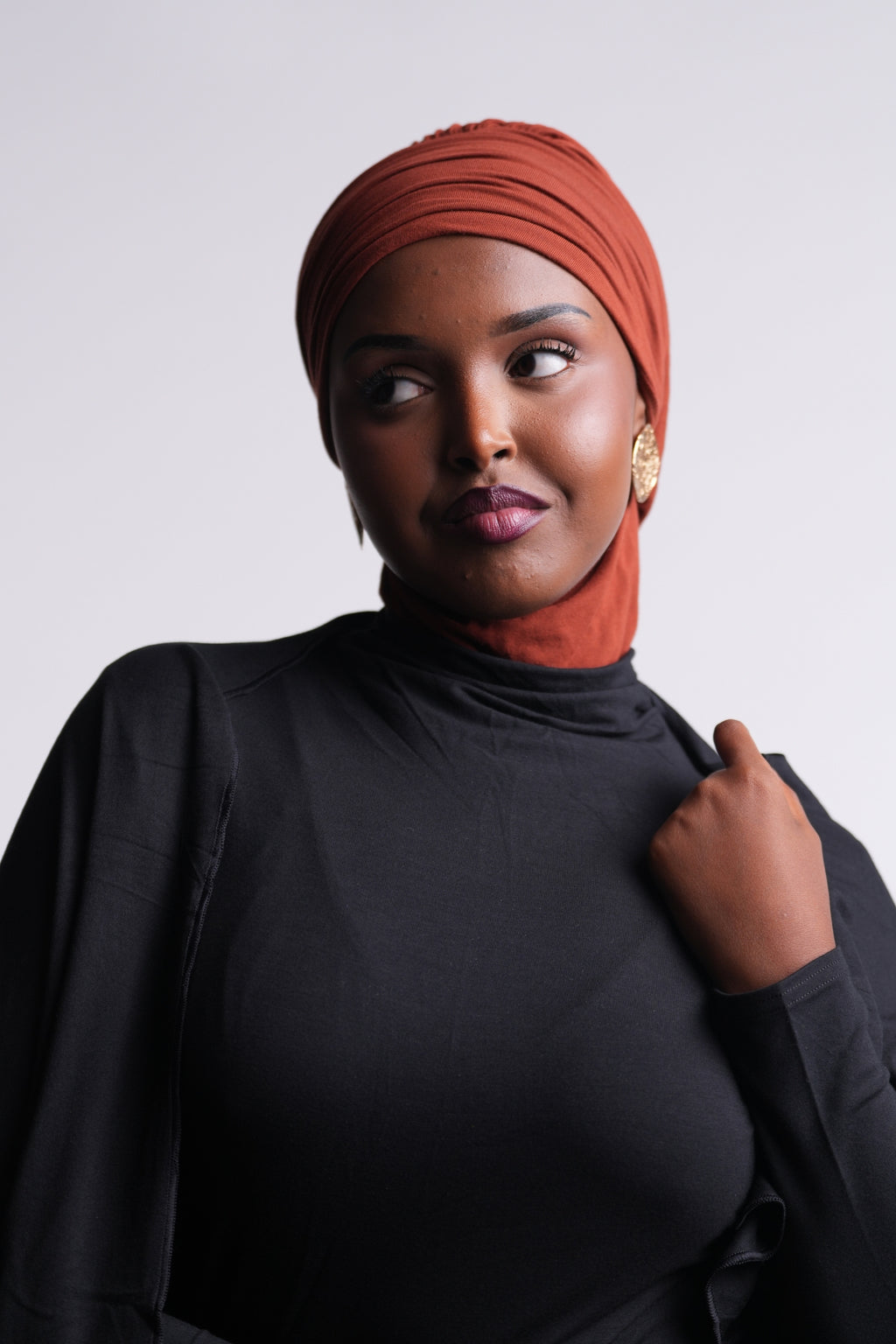 DuoWear 2-in-1 Hijab front view in turban style, with neck coverage under a black turtleneck