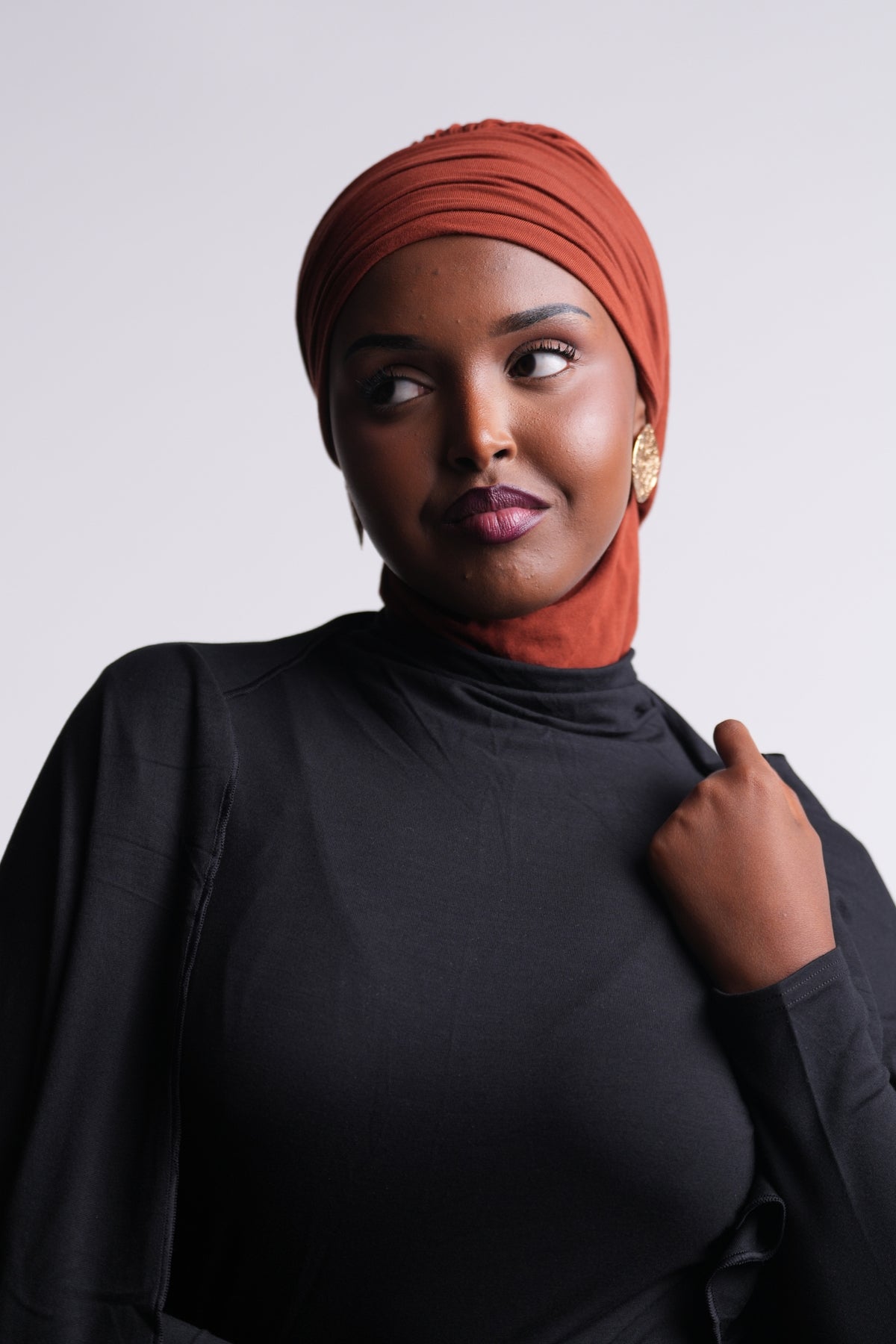 DuoWear 2-in-1 Hijab front view in turban style, with neck coverage under a black turtleneck