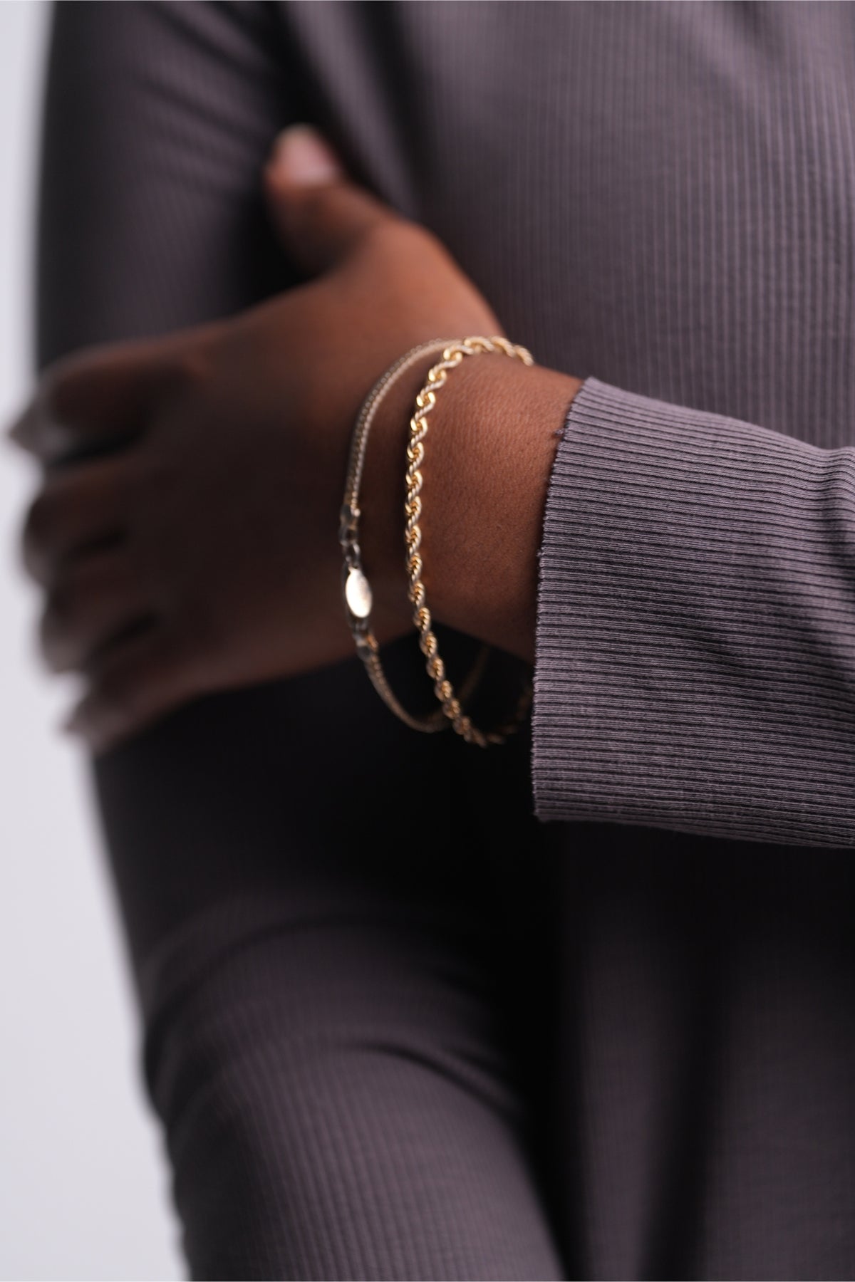 Close-up of the Mink Flow Tunic’s ribbed knit texture and fitted cuff.