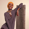 Woman wearing modest flow tunic and 2-in-1 slip-on hijab set in a modern neutral tone