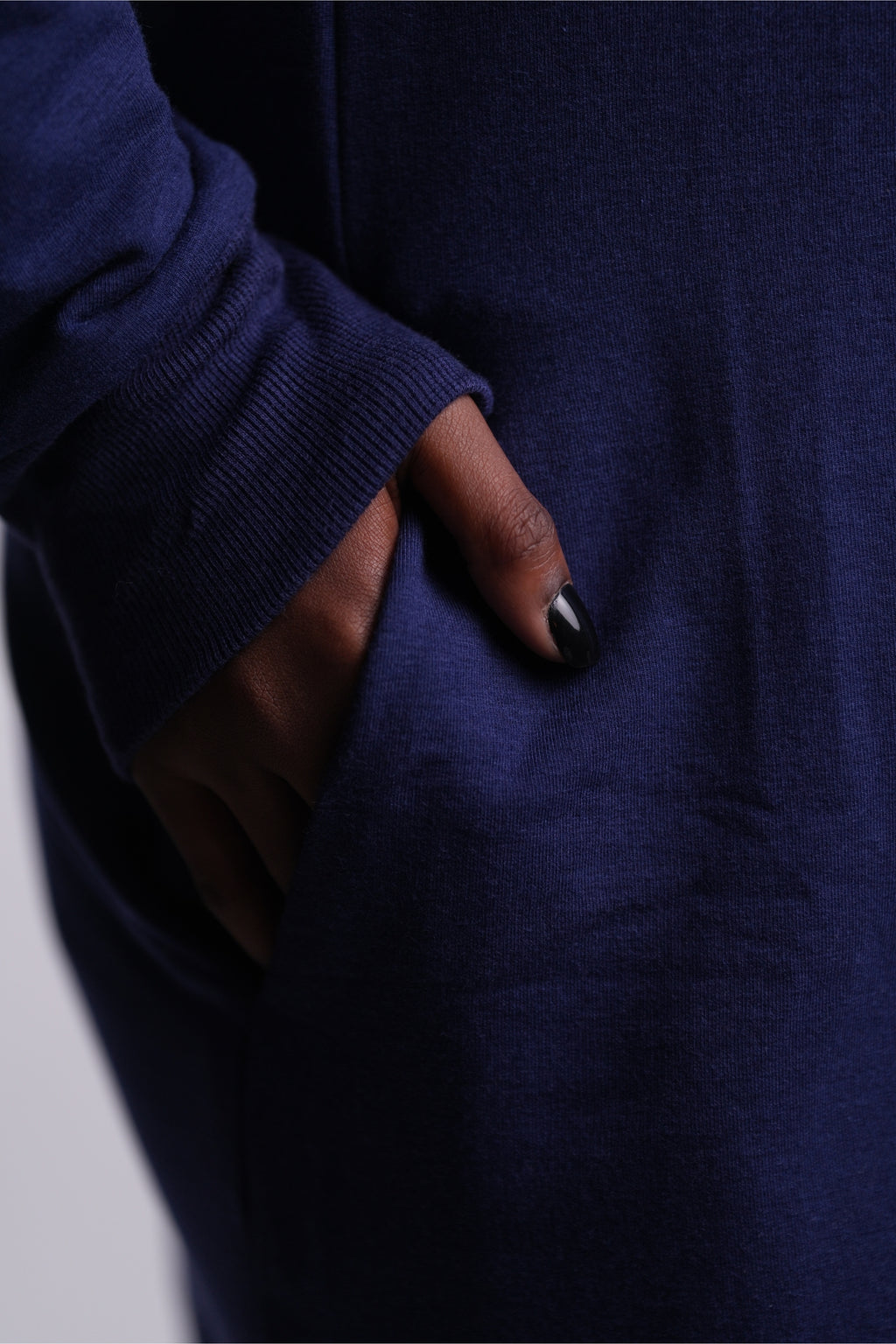 Revive Fleece Pullover close up front view of hand in pocket
