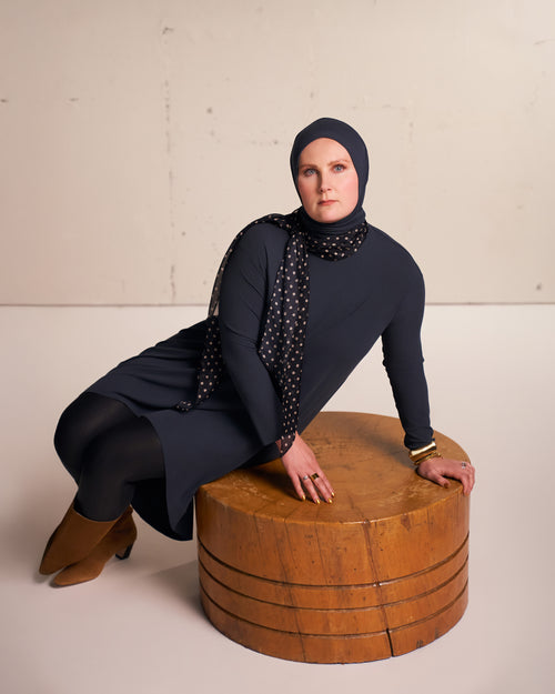 Tencel Modal jersey Solo Snap Hijab in charcoal shown styled with Yalla Flow tunic in studio.